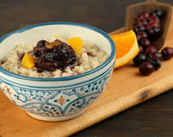 Slow cooked creamy oatmeal with cranberry orange compote