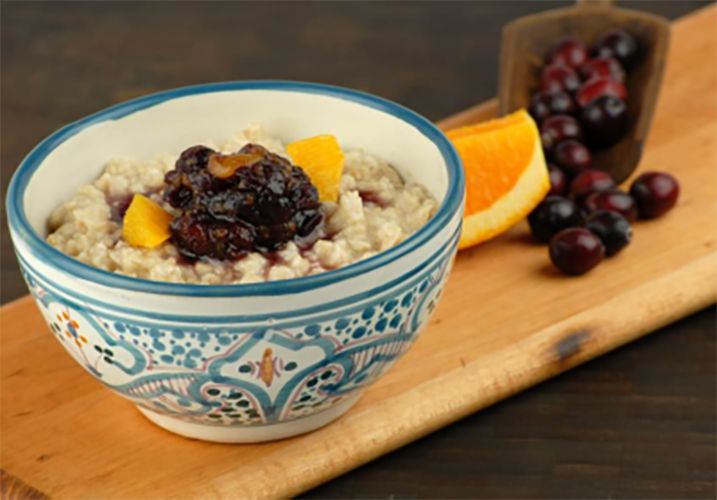 Slow cooked creamy oatmeal with cranberry orange compote